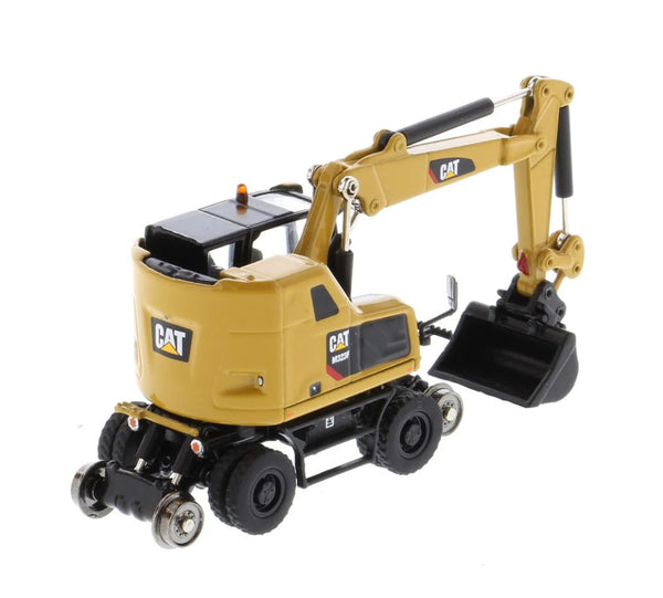 Diecast Masters 1/87 Cat® M323F Railroad Wheeled Excavator with 3 work tools and Collector's Tin