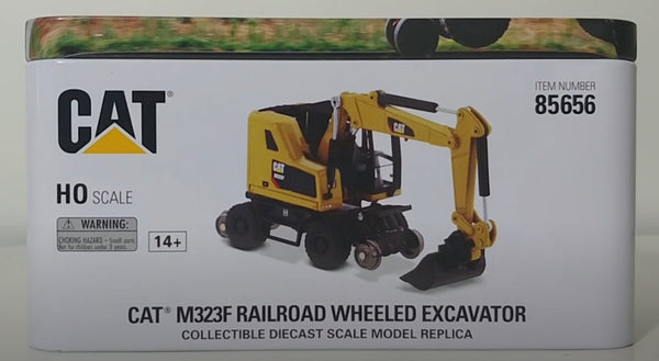 Diecast Masters 1/87 Cat® M323F Railroad Wheeled Excavator with 3 work tools and Collector's Tin